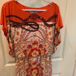 Orange patterned dress.